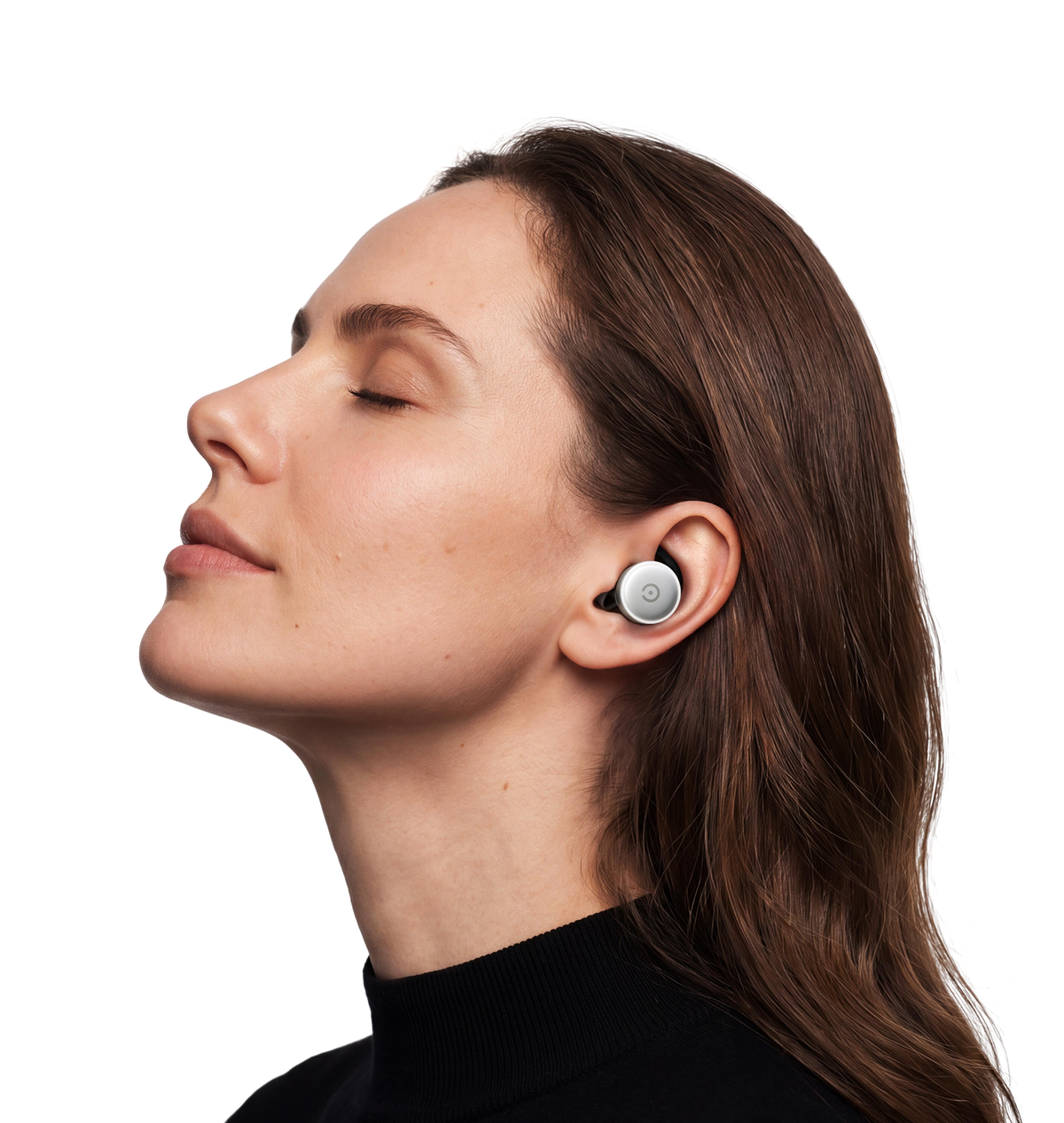 Woman wearing the Zeno One auricular wellness device